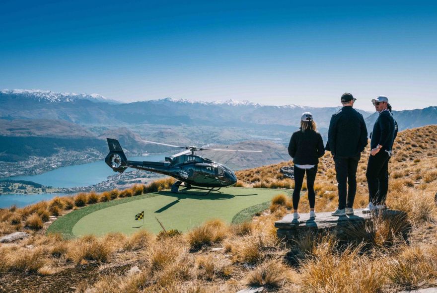 Golf hole over the top helicopter and golfers